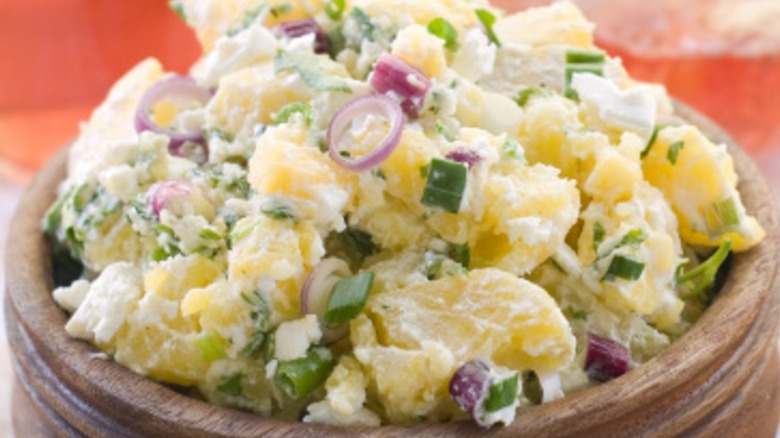 Potato salad in a wooden bowl