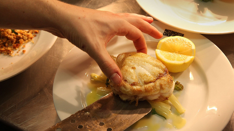 A plate of monkfish is served at a chop house