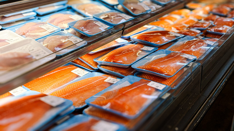 Packaged salmon on display at a grocery store