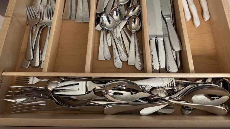 Open drawer of silverware
