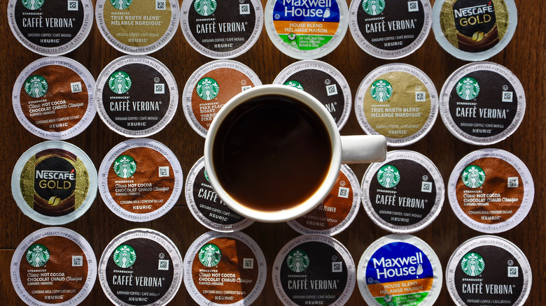 Cup of coffee and rows of K-Cups