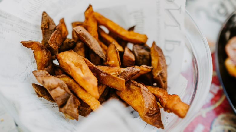 sweet potato fries on white paper