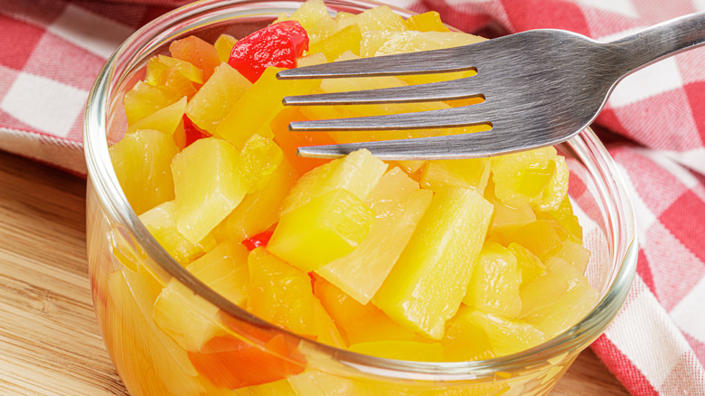 Glass bowl of canned fruit cocktail