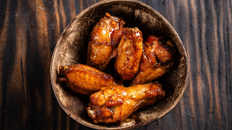 A bowl of golden-brown, juicy chicken wings