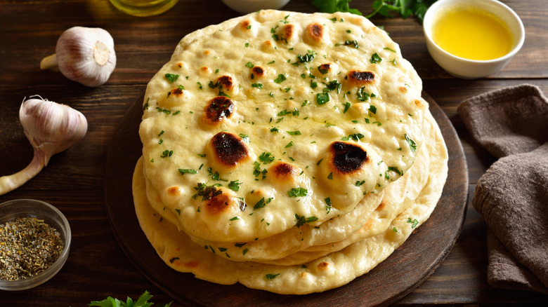 Stack of Indian naan flatbread with garlic butter
