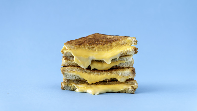 A stack of halved grilled cheese sandwiches