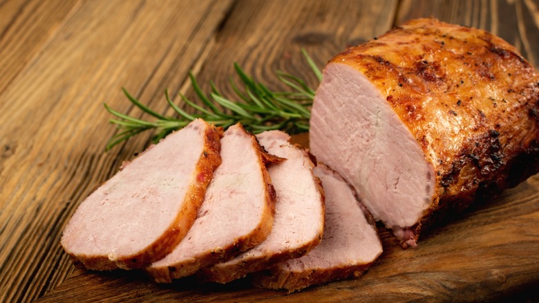 Roast pork tenderloin on a wooden cutting board