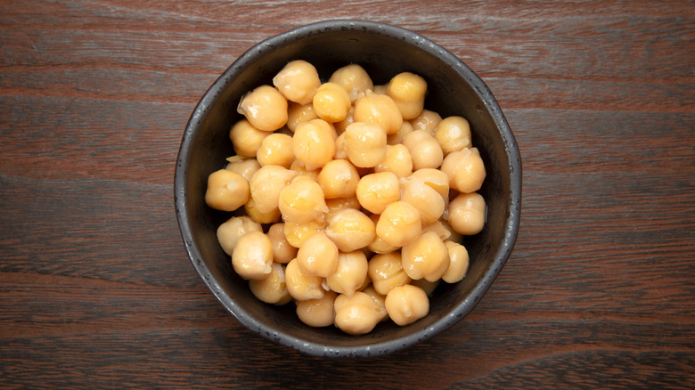 Canned chickpeas in a black bowl