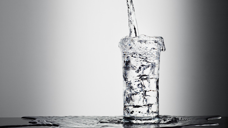 Glass of water being poured