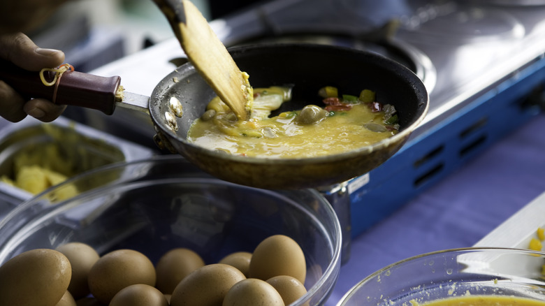 Scrambled eggs being cooked