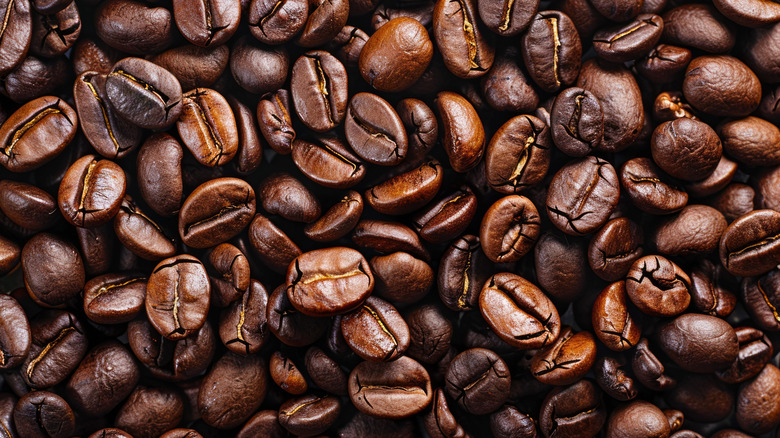 A top-down view of a large pile of coffee beans