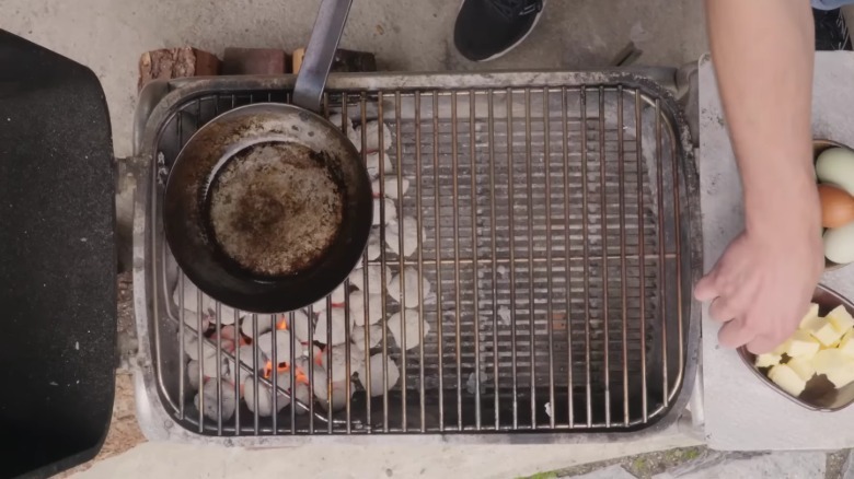 A grill that has been set up for two-zone grill