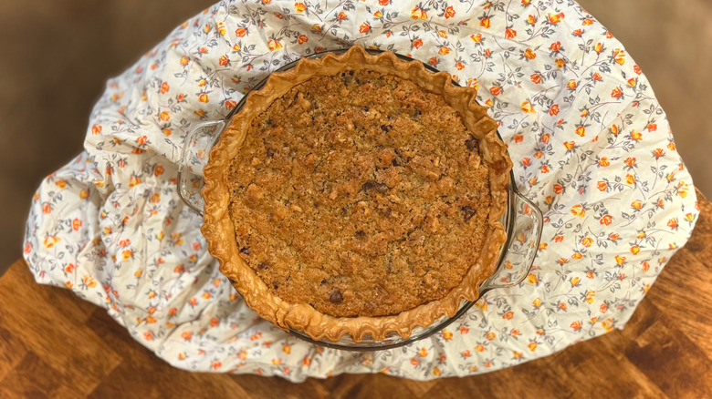 Browned pie on flowered cloth