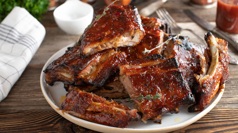 Pile of pork ribs on a white plate