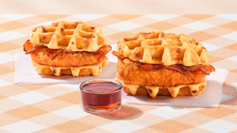 A promotional image of Chick-fil-A's chicken and waffles sandwiches