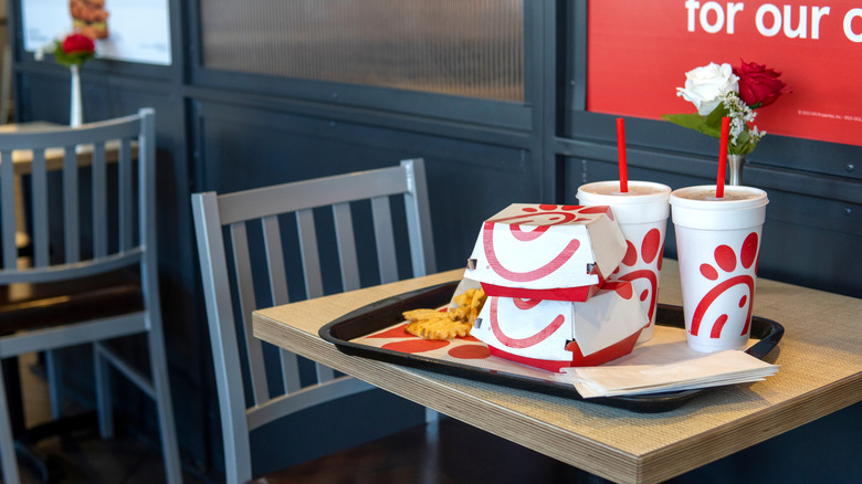 Packages of food on a table at a Chick-fil-A location.