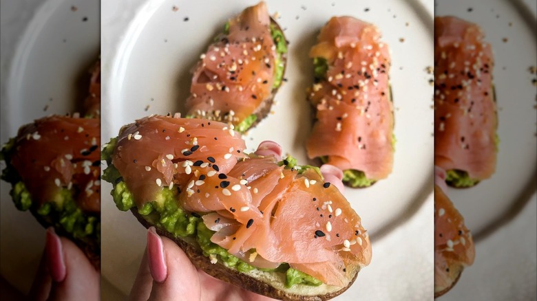 Broiled potato slices topped with avocados and smoked salmon