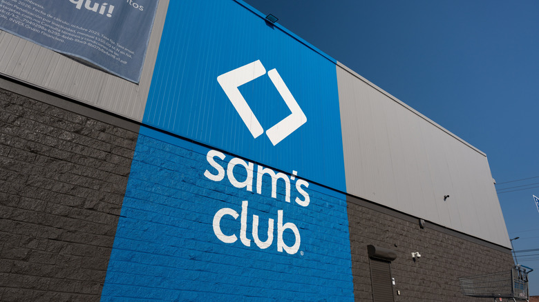 The new Sam's Club logo painted onto the side of a Sam's Club location during the daytime.