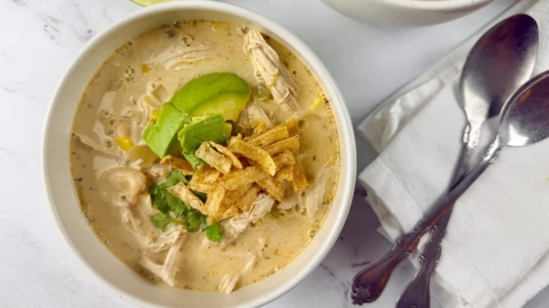 Bowl of white chili with shredded chicken