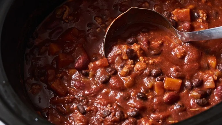Ladle in pot of turkey chili