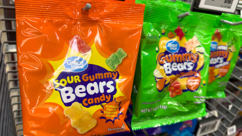 Bags of Great Value gummy bears sitting on the rack in store.