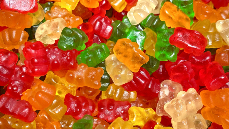 Gummy bears in various colors in a big pile.