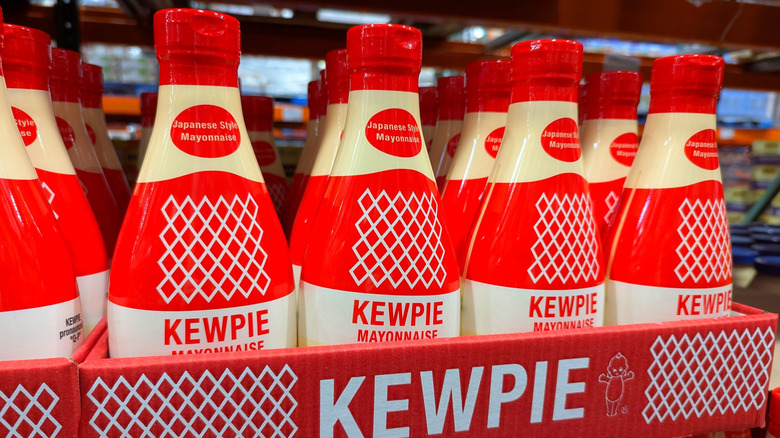Kewpie mayonnaise bottles in cardboard box on a store shelf