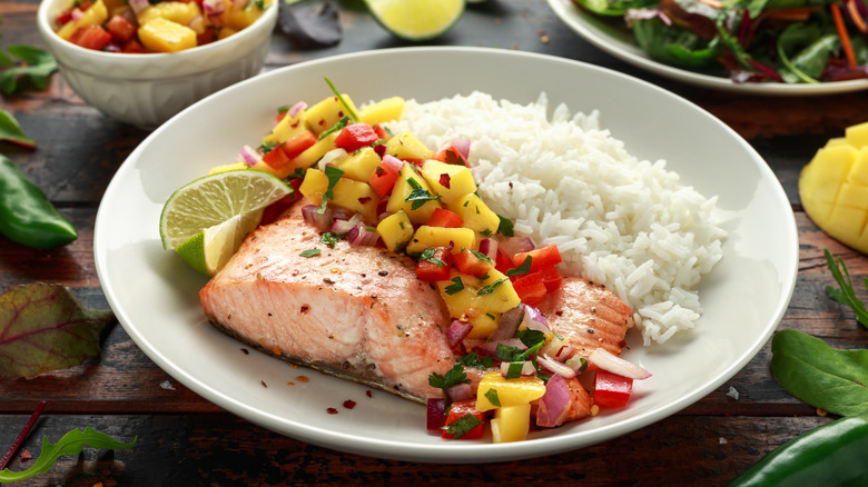 Plate with salmon and mango salsa with rice