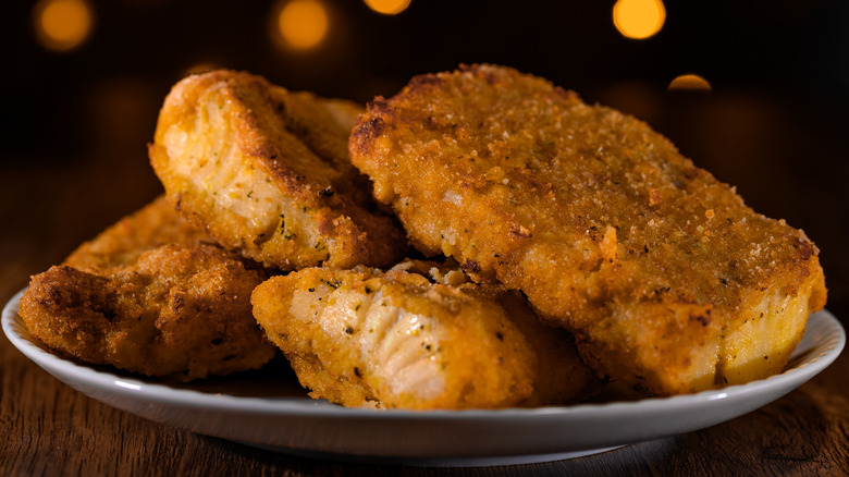 breaded white fish on plate