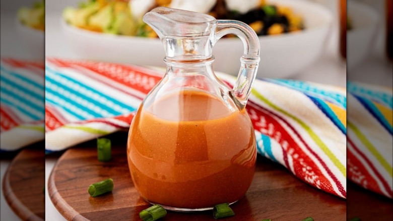 Small glass pitcher of Catalina salad dressing