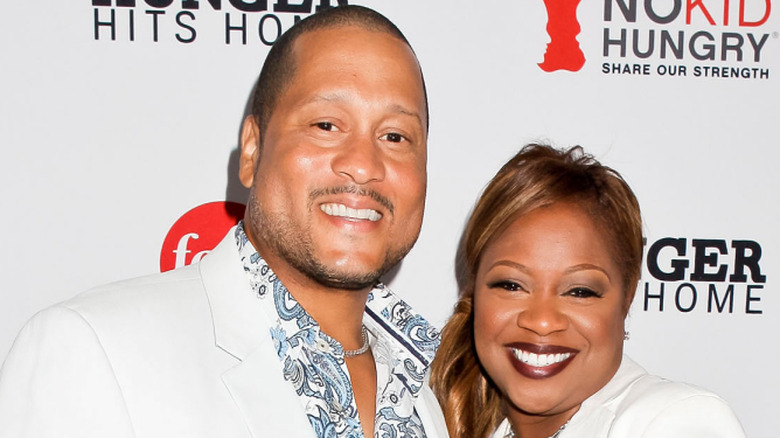 Gina and Pat Neely standing close and smiling