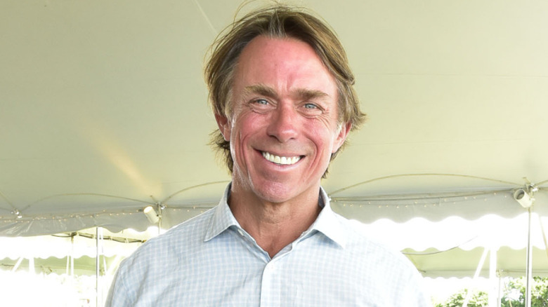 John Besh smiling in an event tent