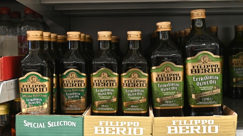 Bottles of Filippo Berio on a supermarket shelf.
