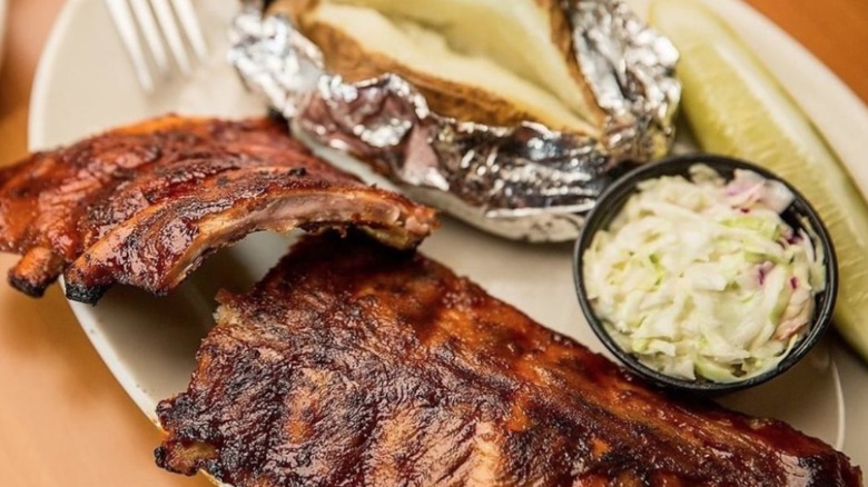 Ribs, baked potato, and coleslaw at the  Twin Anchors Restaurant and Tavern