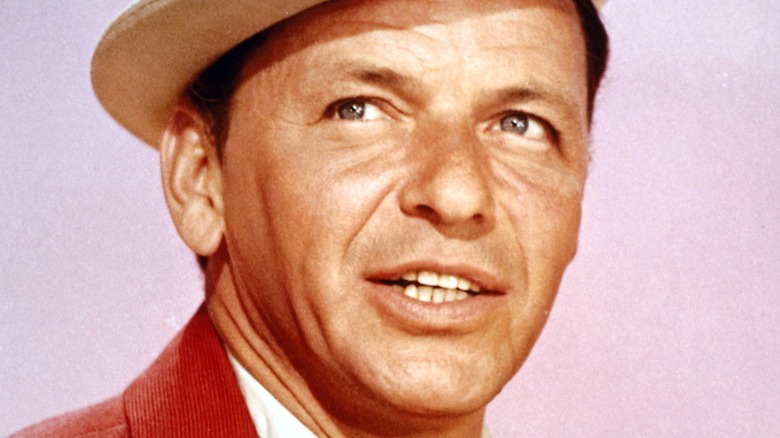 A portrait of Frank Sinatra in a white hat