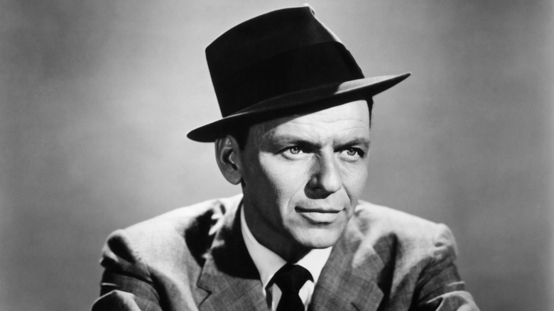 Frank Sinatra posing in a hat