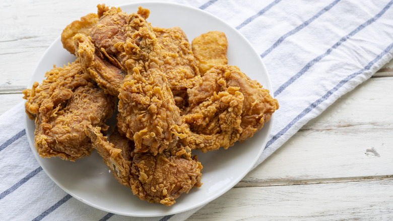 White plate of fried chicken