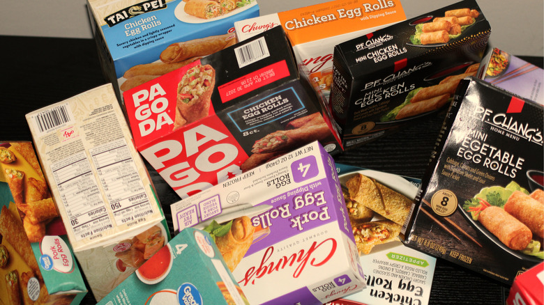 A randomized pile of boxes containing frozen egg rolls