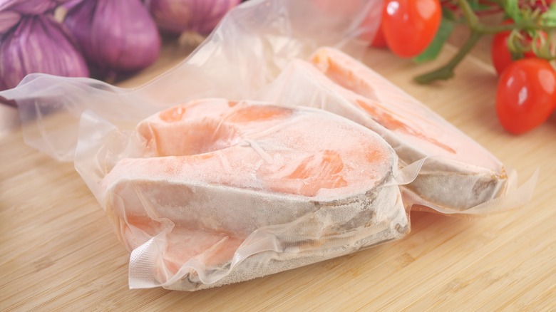 Frozen fish fillets on a counter.
