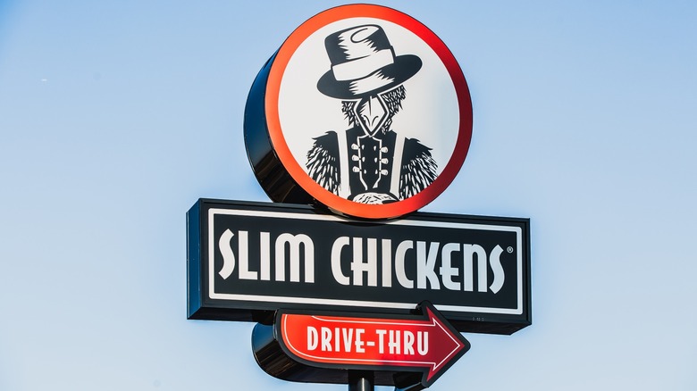 A Slim Chickens drive-thru sign