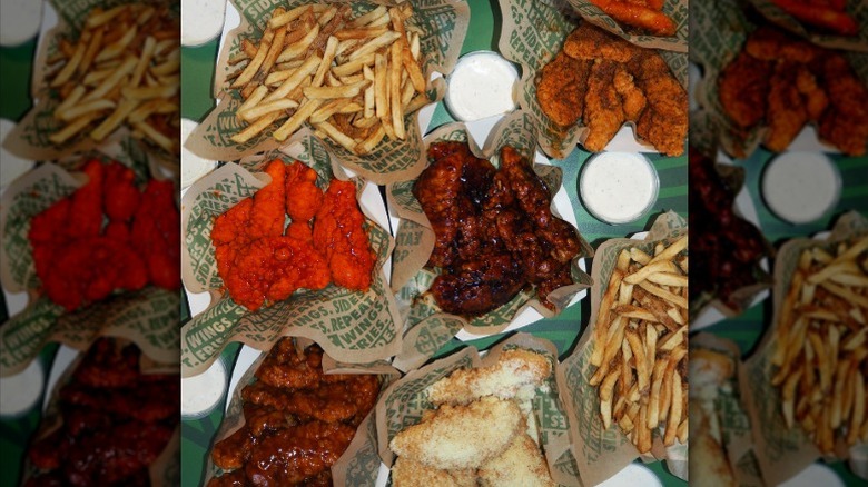 Fries and different flavored wings from Wingstop