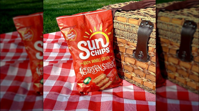Bag of SunChips next to picnic basket