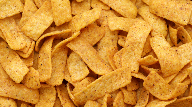 A close up of many Fritos corn chips