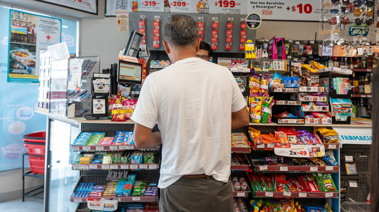 A person checking out at a convenience store