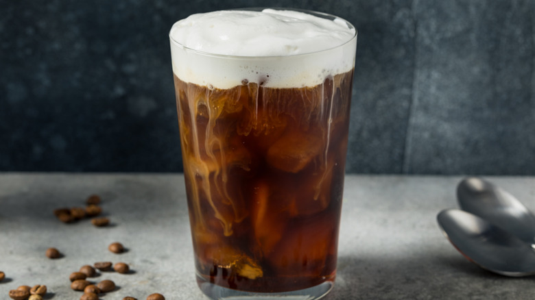 frothed milk on top of cold coffee beverage