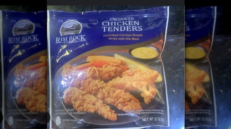 A bag of uncooked chicken tenders from Rim Rock Farms sitting on a counter.