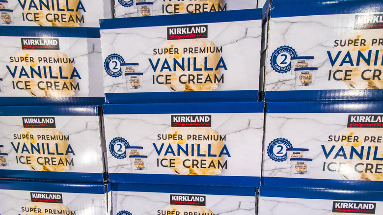 Boxes of Kirkland Signature Super Premium Vanilla Ice Cream in rows in Costco freezer aisle