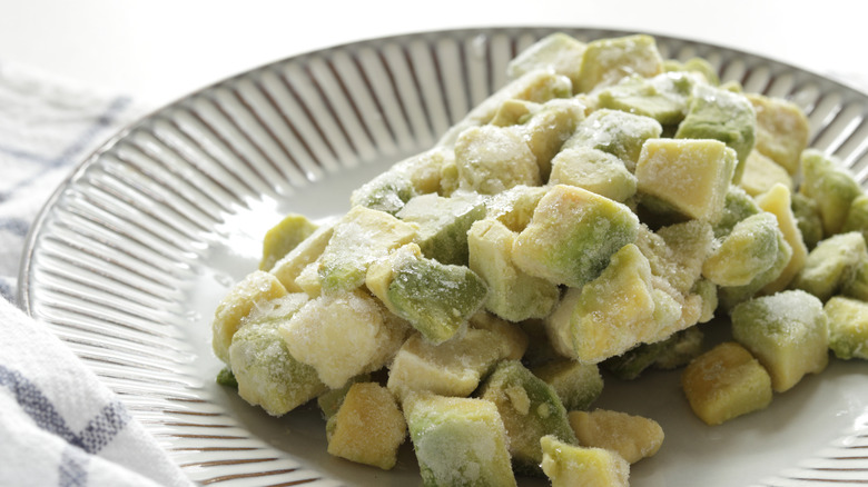 Frozen avocado chunks in a white dish