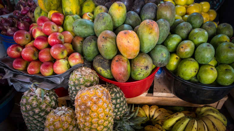 A display of tropical fruits in an outdoor market