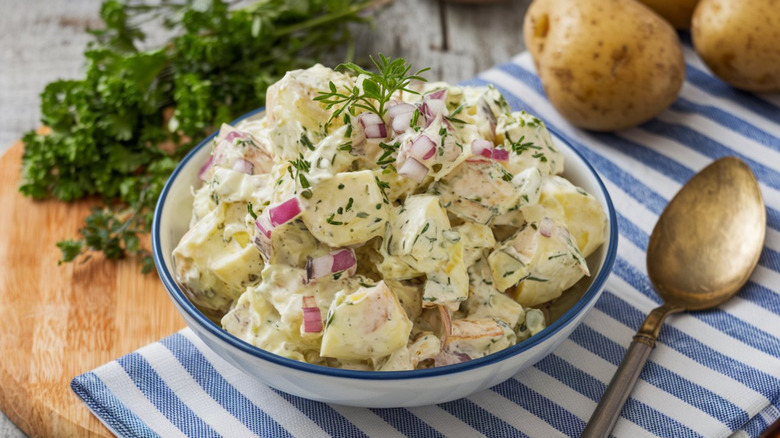 creamy potato salad with red onions and herbs